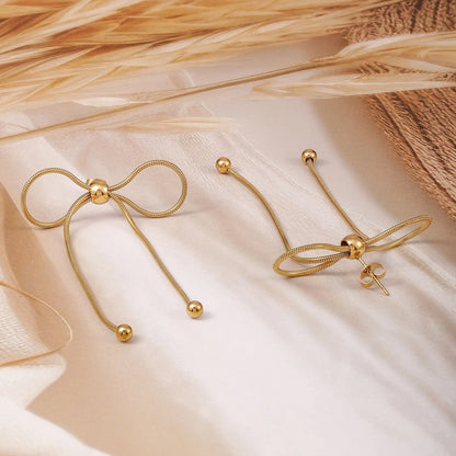 Golden Bow Elegance Earrings – A Timeless Treasure by Zenvy
